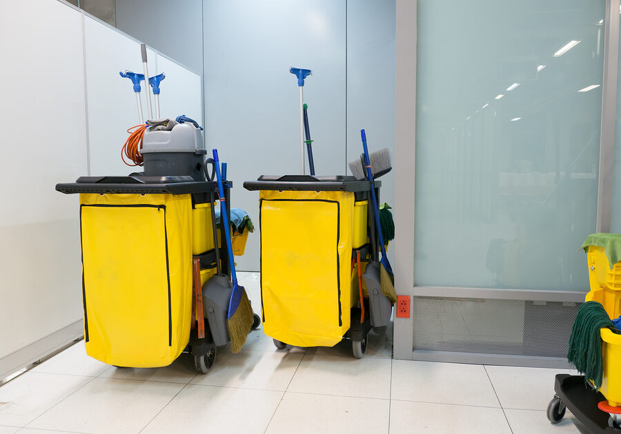 Cleaning Cart in the station. Cleaning tools cart and Yellow mop bucket wait for cleaning.Bucket and set of cleaning equipment in the airport office.